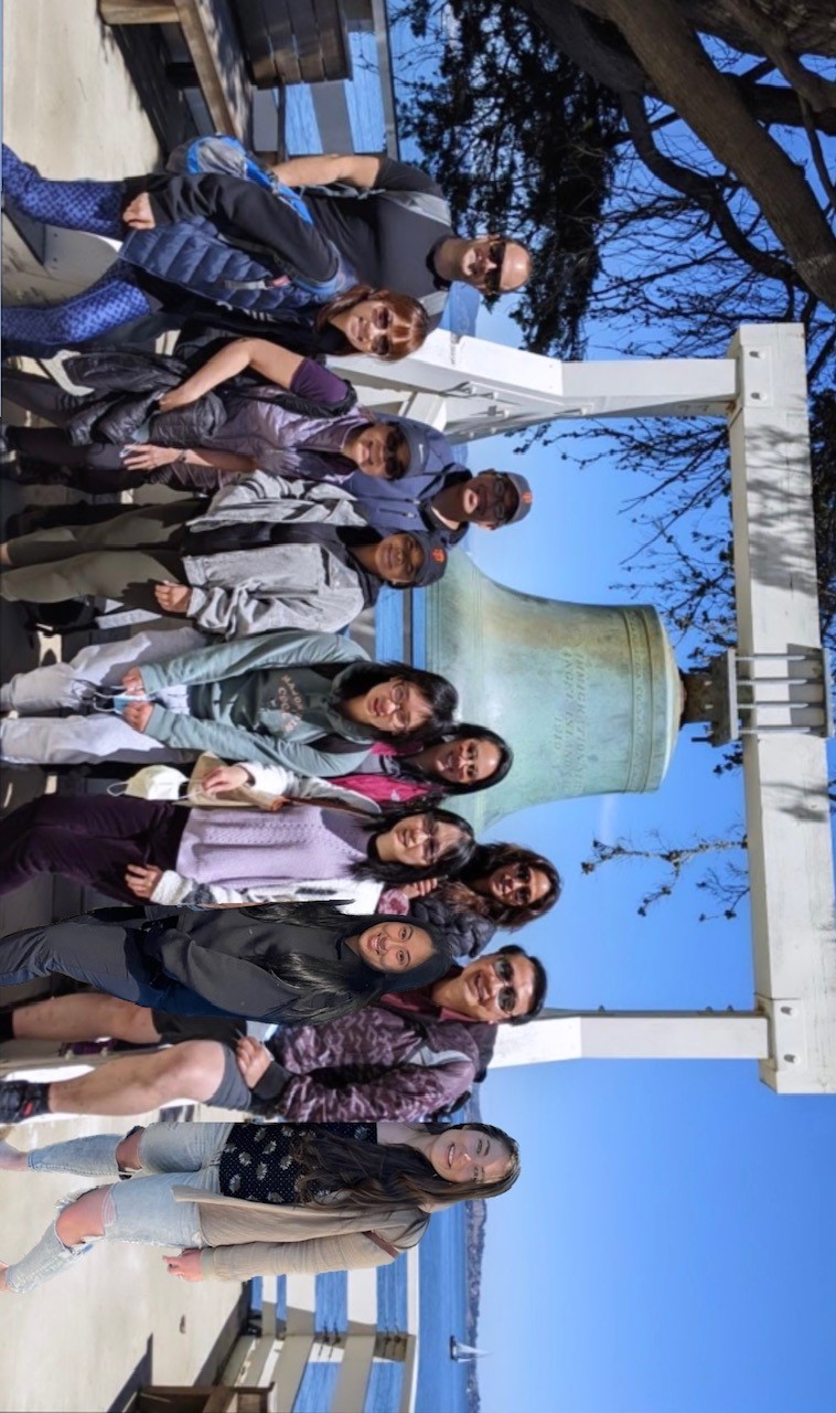 Pulmonary admin team at Angel Island in front of bell landmark